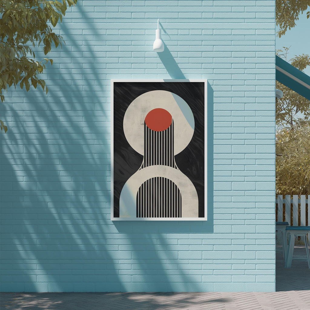 a blue wall with a framed abstract artwork hanging on it.