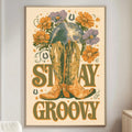 a poster with a cowboy boot and flowers, along with the text "STAY GROOVY" displayed prominently.