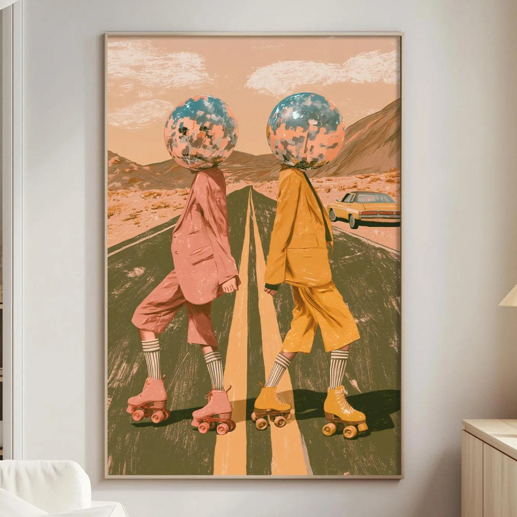 a large framed artwork depicting two people on rollerblades, with one person wearing a pink outfit and the other wearing a yellow outfit, set against a desert landscape with mountains in the background.