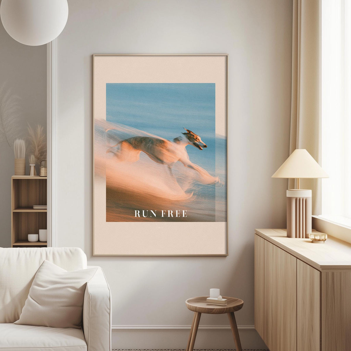 a large framed poster of a blurred animal, likely a horse, with the text "RUN FREE" below it, hanging on a wall in a living room setting.