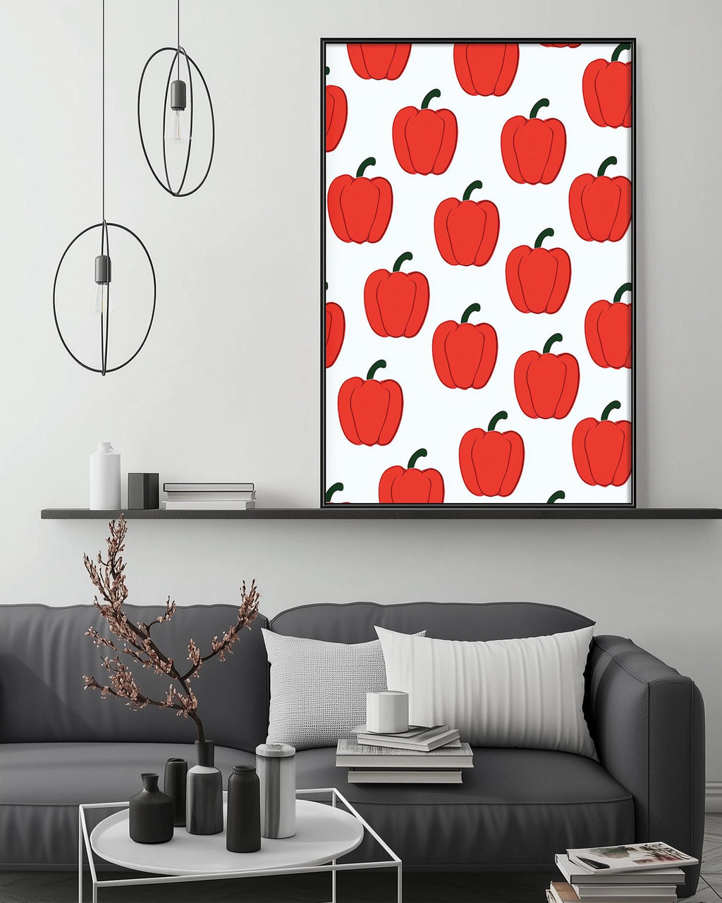 a modern living room with a gray sofa, a coffee table, and a large framed print of red peppers on the wall.