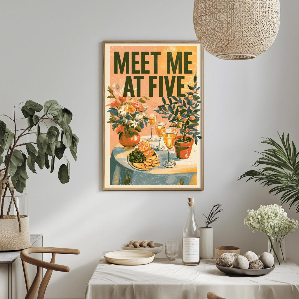 a dining table with a tablecloth, a bowl of fruit, a bottle, and a vase with flowers. Above the table, there is a framed poster with the text "MEET ME AT FIVE" and an illustration of a table with food and drinks.