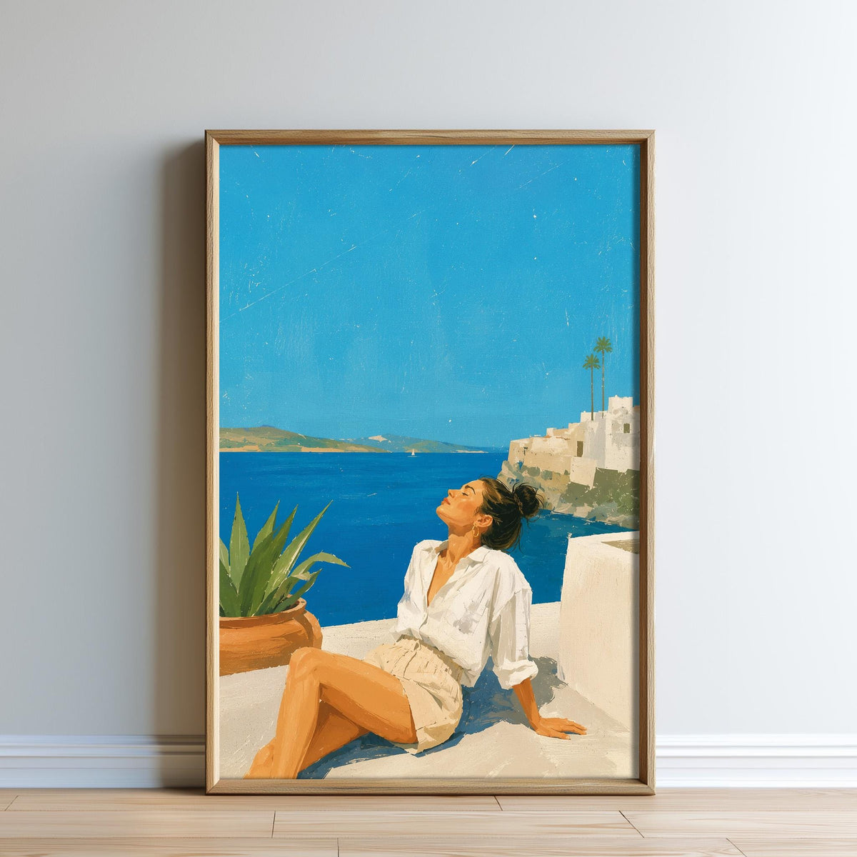 A woman is sitting on a balcony, looking out at the ocean and the buildings in the distance.