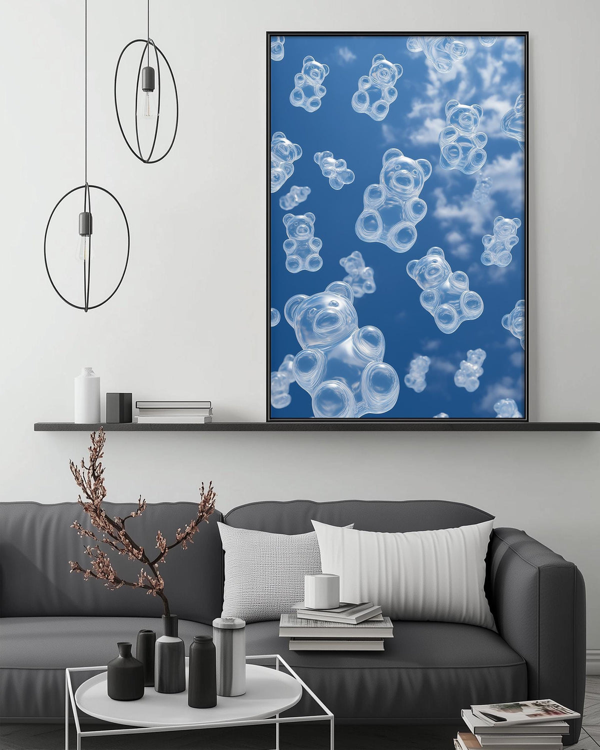 a modern living room with a gray sofa, a coffee table, and a large framed picture of floating teddy bears against a blue sky background.