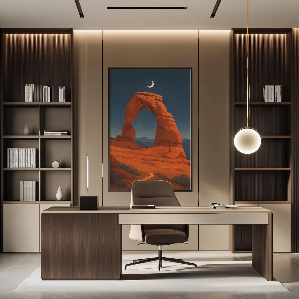 a modern office space with a large framed picture of a desert landscape hanging on the wall, creating a serene and natural atmosphere. The office has a wooden desk, a comfortable chair, and a pendant light above the desk, providing ample lighting for work. The room also includes built-in bookshelves and a large window, allowing natural light to fill the space.