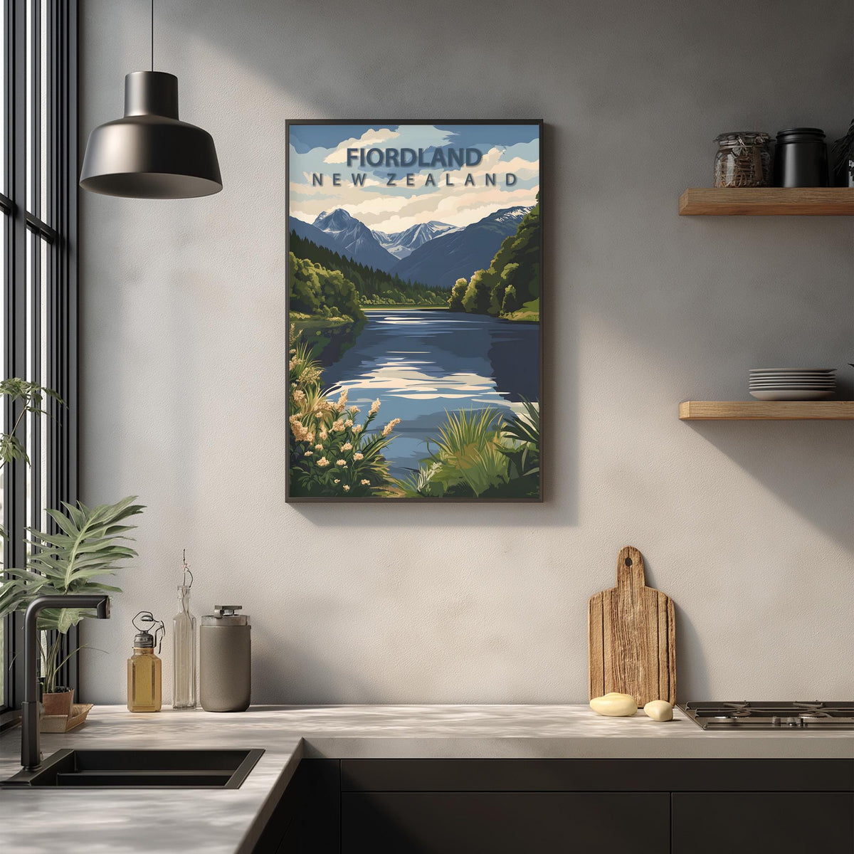a kitchen counter with a framed poster of a scenic landscape hanging on the wall above it.