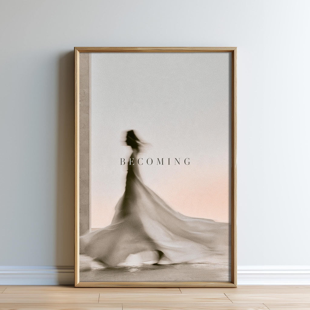 The image is a framed poster with a blurred silhouette of a person in a flowing dress, set against a pinkish-orange background.