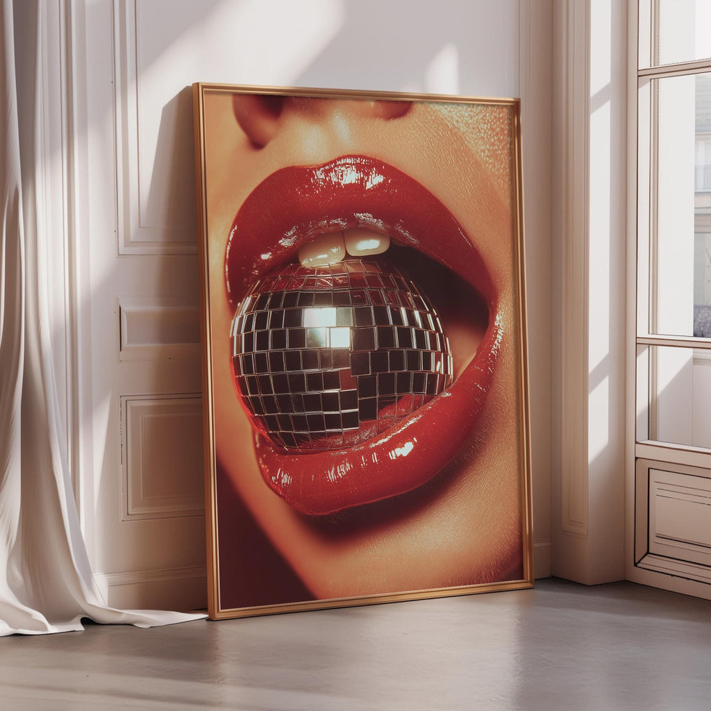 A large framed poster featuring a close-up of a person's lips with a disco ball inside, creating a striking and bold visual effect.