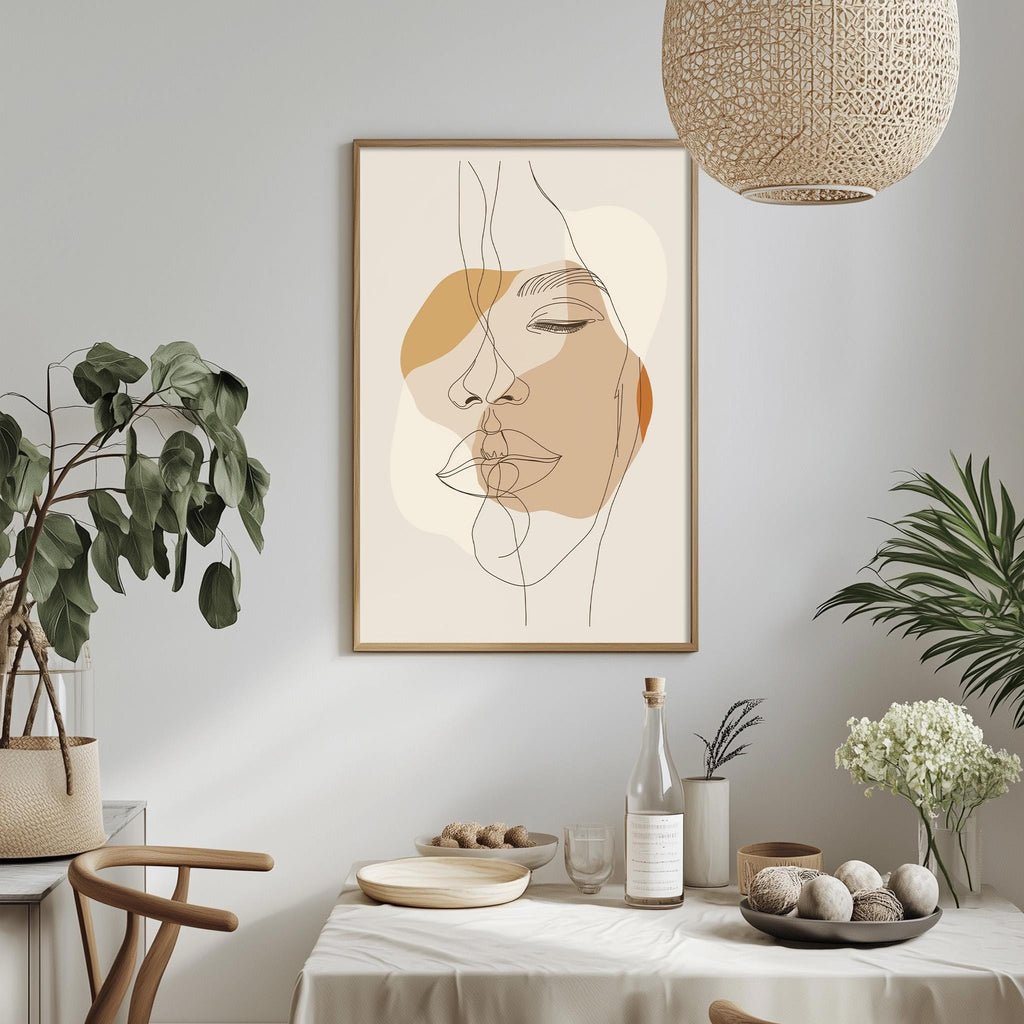 a minimalist dining room with a framed abstract portrait of a woman's face hanging on the wall above a table set with various items.