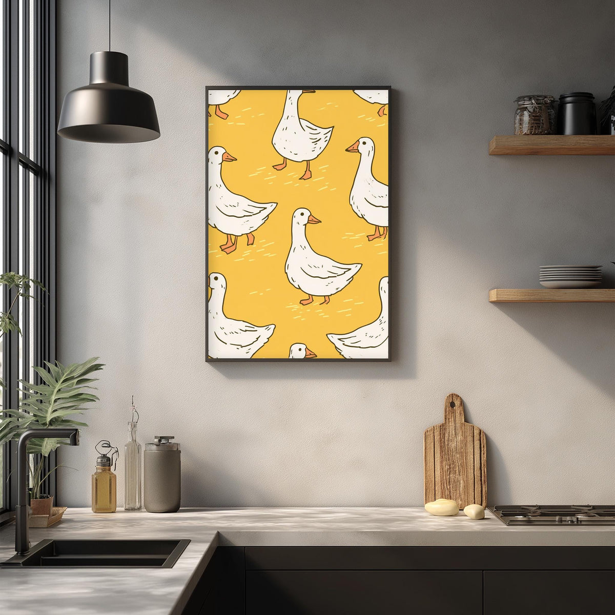 a kitchen counter with a framed print of white ducks on a yellow background hanging above it. The kitchen counter also has various kitchen items such as a cutting board, a soap dispenser, and a bottle.