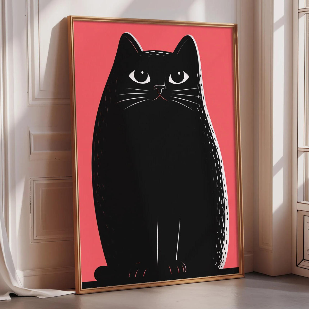 A large framed poster of a black cat with a pink background, sitting on a wooden floor.