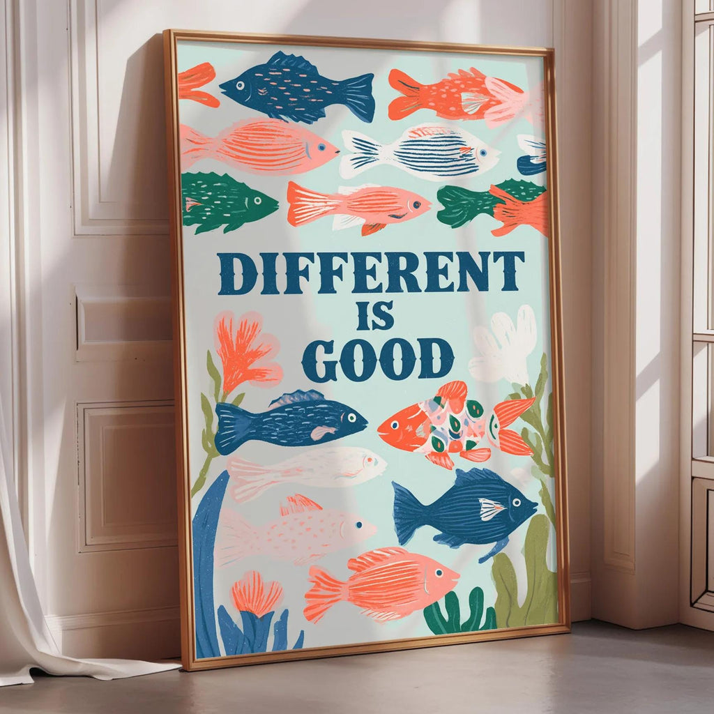 a poster with a colorful illustration of fish and plants, along with the text "DIFFERENT IS GOOD" displayed prominently.