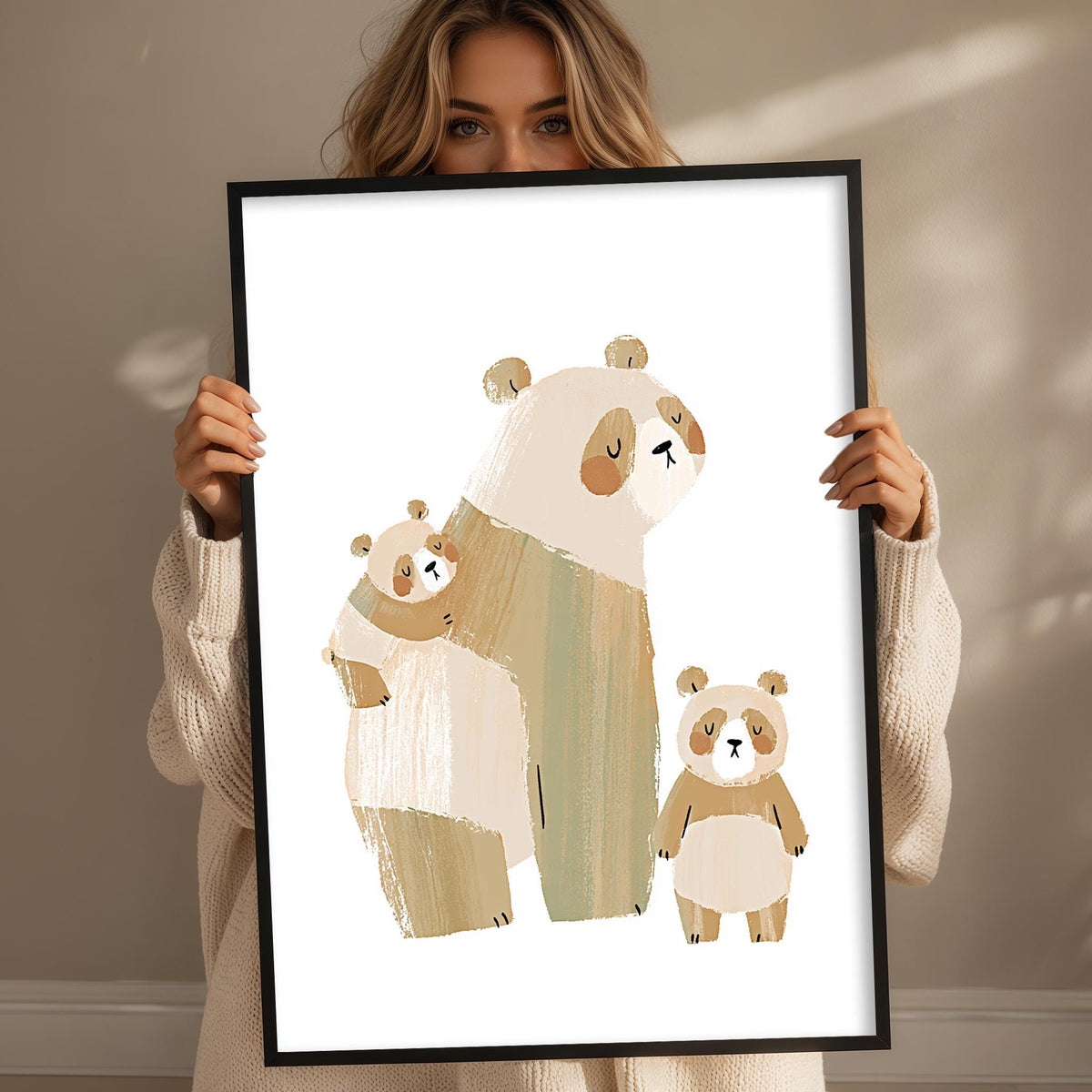 A woman is holding up a framed print of three cartoon bears, each with different poses and expressions.