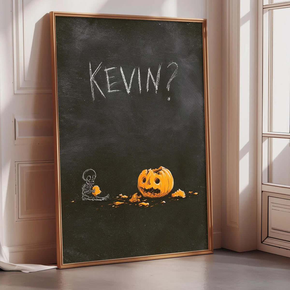a Halloween-themed chalkboard with the name "KEVIN?" written on it. Below the name, there is a drawing of a pumpkin with a carved face.