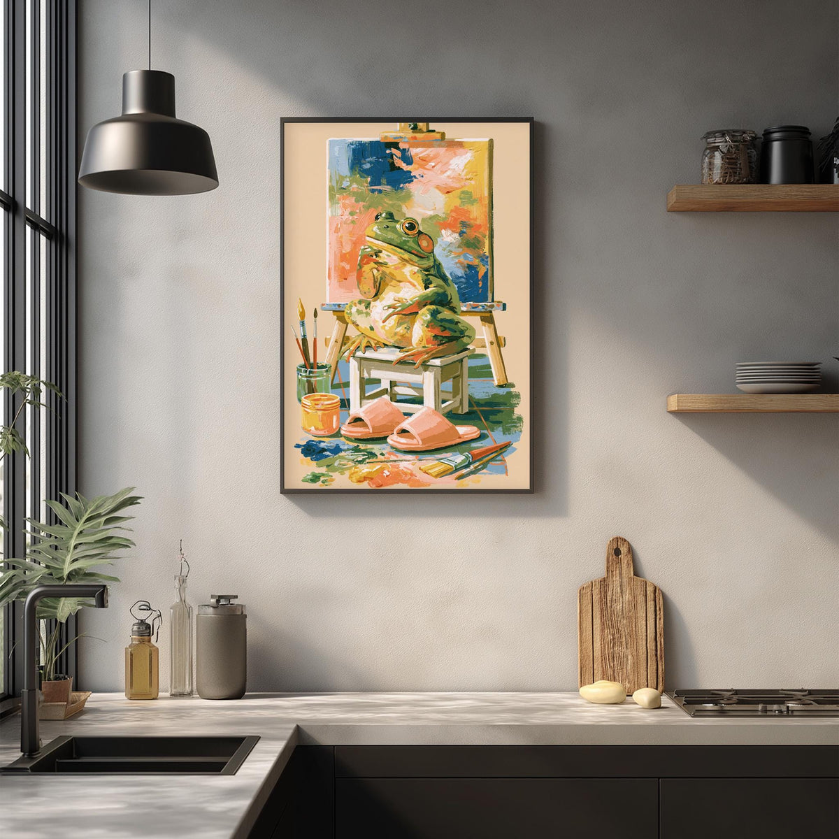 a framed painting of two frogs sitting on a chair, surrounded by various art supplies and a wooden cutting board, all set against a white wall.
