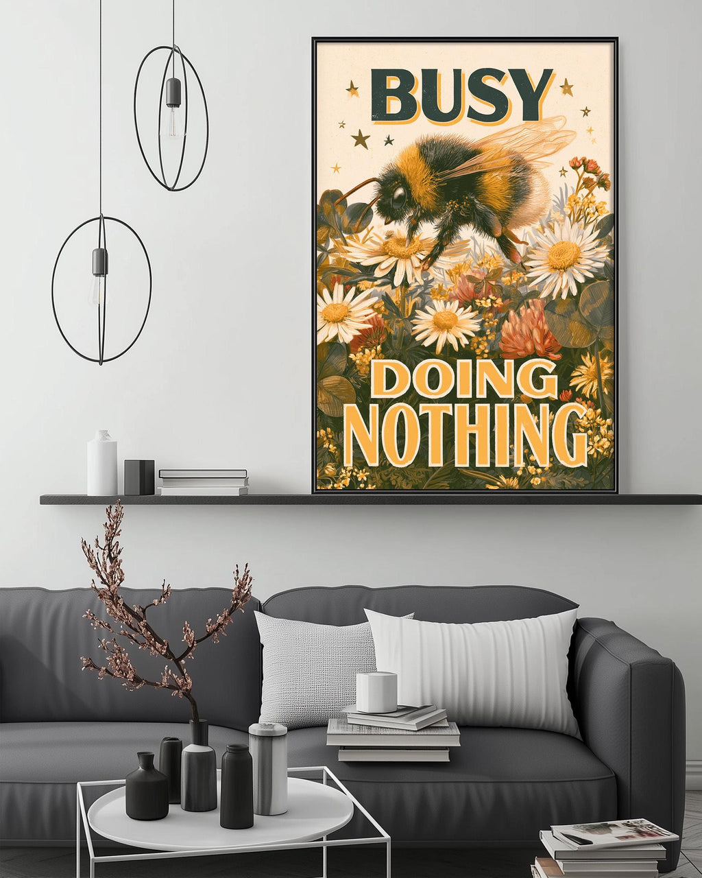 a poster with a bee and flowers, hanging on a wall above a couch in a living room setting.