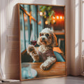 A fluffy white dog wearing sunglasses is sitting at a table, holding a glass of red wine.