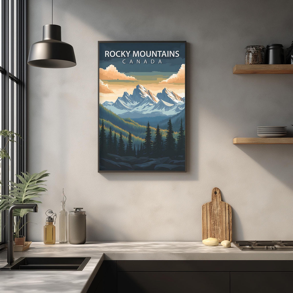 a kitchen counter with a framed poster of Rocky Mountains Canada hanging on the wall above it.