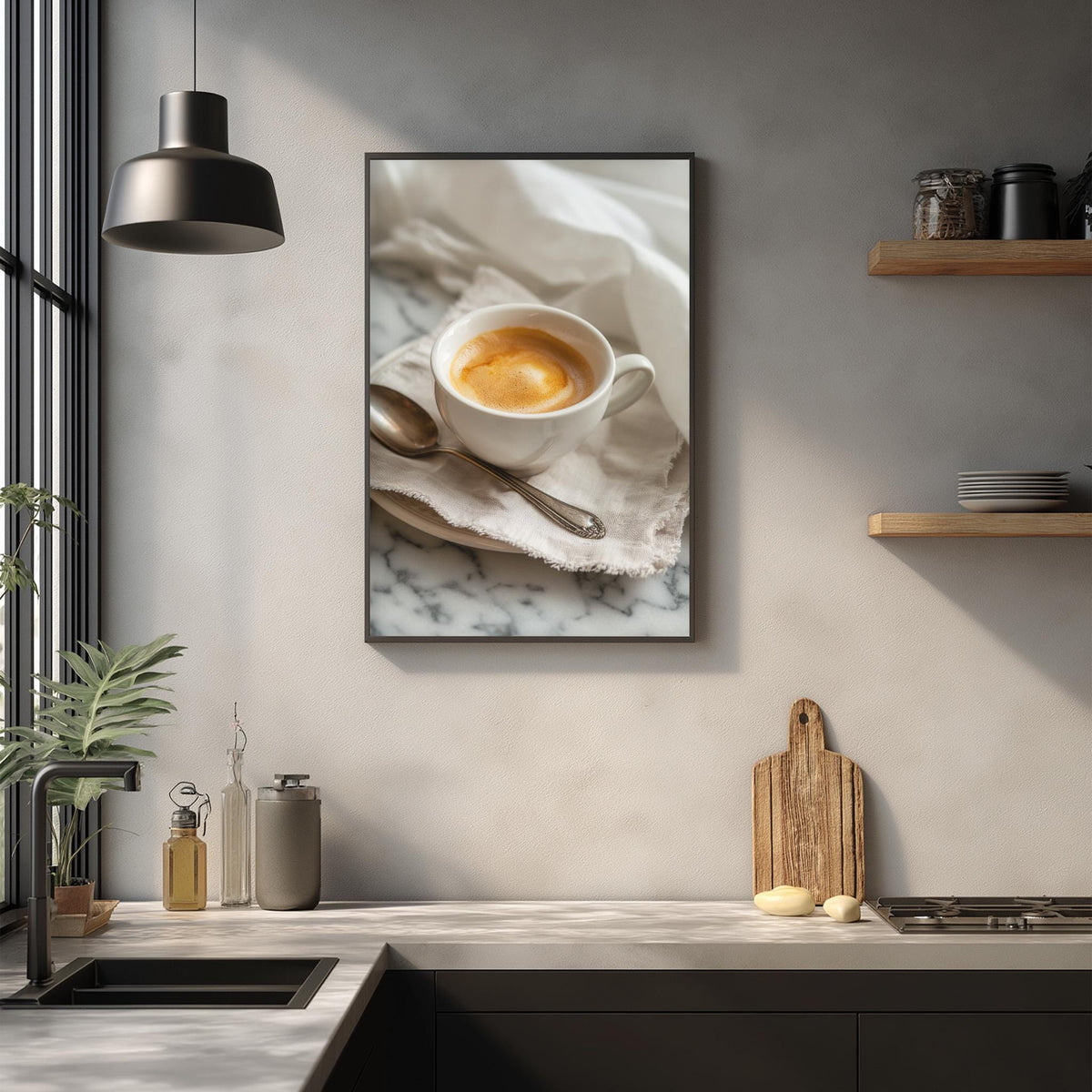 a framed photograph of a cup of coffee on a marble countertop, with a wooden cutting board and other kitchen items visible below the frame.