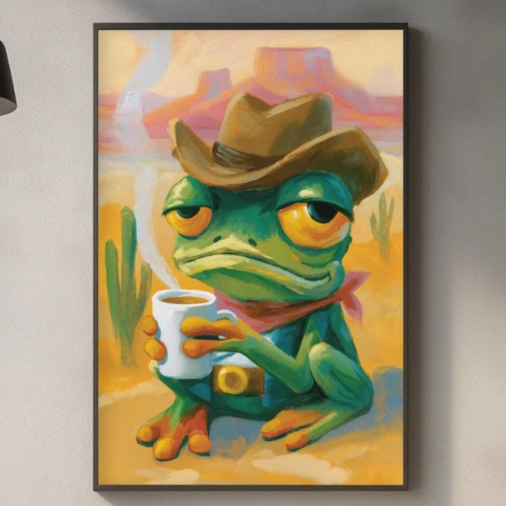 a framed painting of a frog wearing a cowboy hat, sitting on a counter in a kitchen setting.