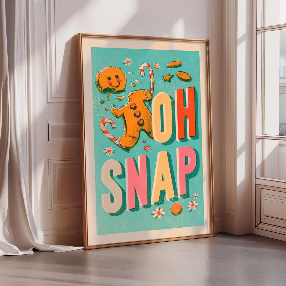 A framed poster with a colorful design featuring a gingerbread man and the text "OH SNAP" in a playful, whimsical style.