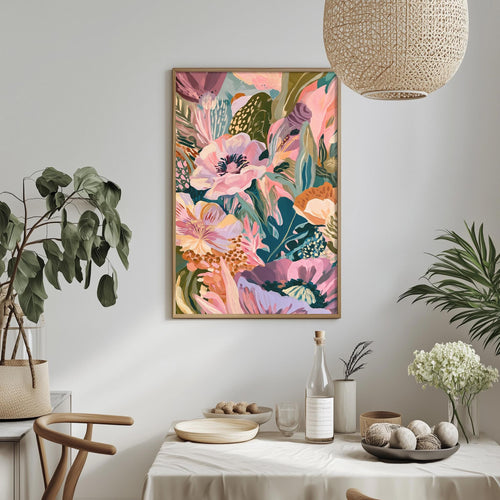 a vibrant and colorful floral painting hanging on a wall above a dining table, which is set with various decorative items such as a potted plant, a vase, and a bowl.