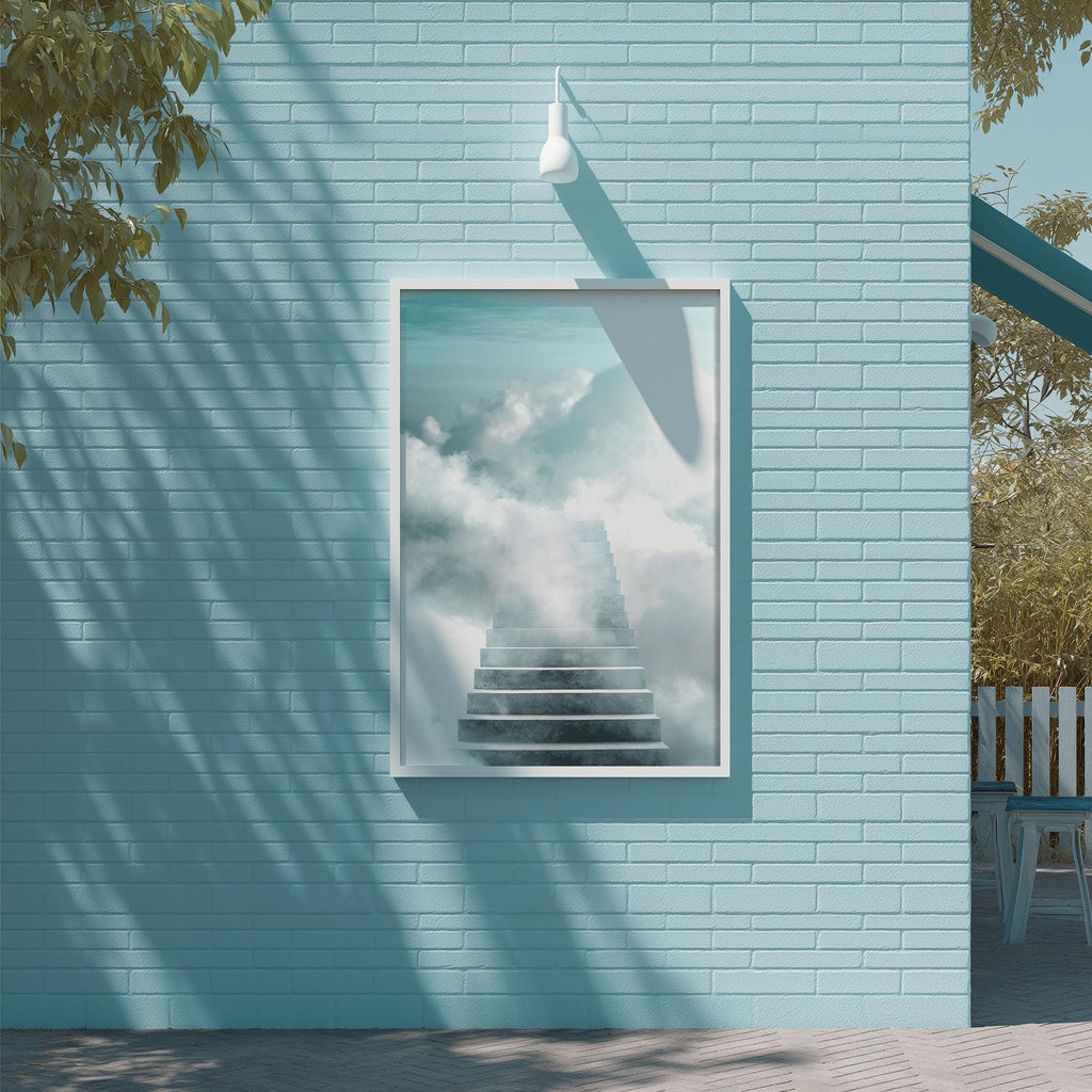 a blue brick wall with a framed picture of a staircase leading up to a cloud-filled sky, creating a serene and dreamy atmosphere.