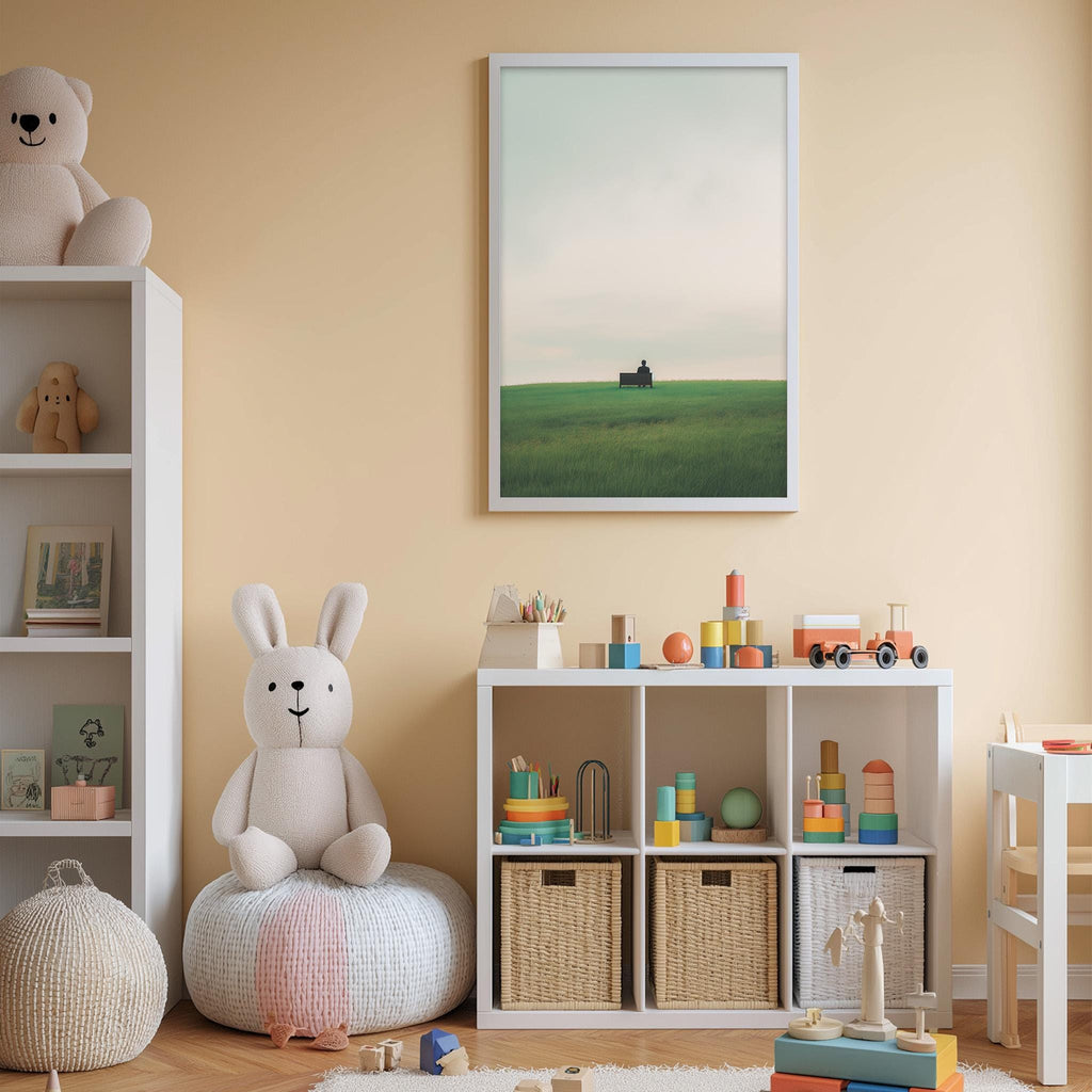 A cozy children's room with a white bookshelf, a plush rabbit, and a toy train set. The room has a warm, inviting atmosphere with a framed picture of a field and a barn hanging on the wall.