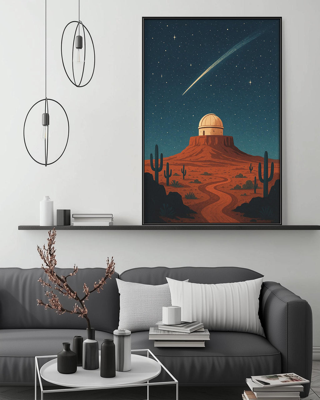 a large, colorful painting of a desert landscape with a crescent moon and stars in the night sky, hanging on a wall above a gray couch with a coffee table in front of it.