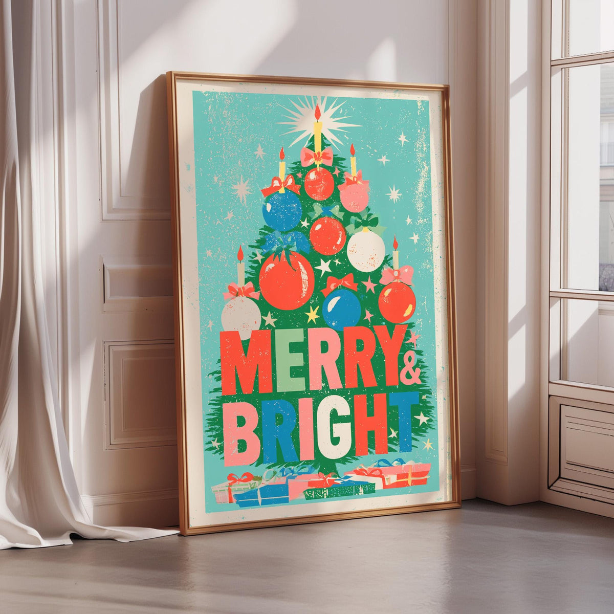 A framed poster with a Christmas tree design and the text "MERRY & BRIGHT" is displayed on a wall.