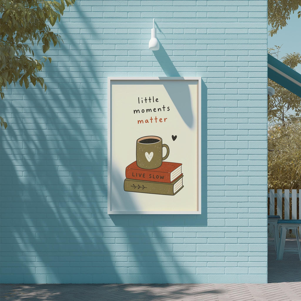 A framed poster with a coffee mug and a book on top, set against a blue brick wall.