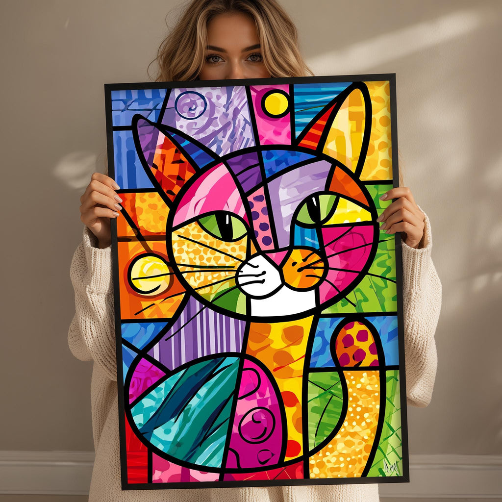 A woman is holding up a colorful abstract painting of a cat, which is composed of various geometric shapes and patterns in a vibrant palette of colors.