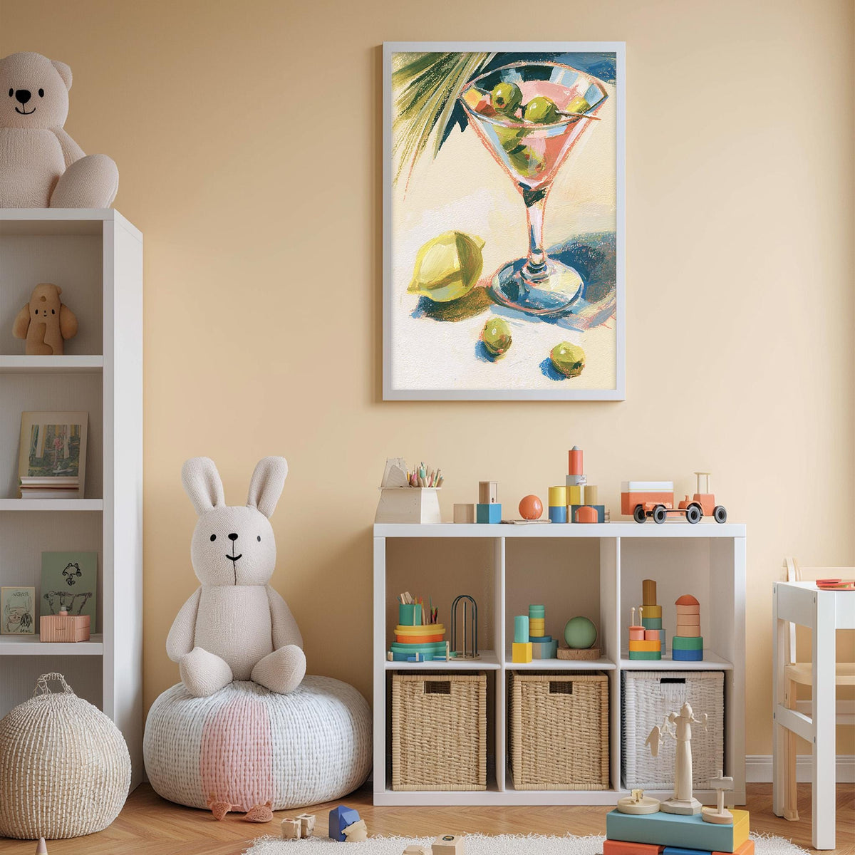 A cozy children's room with a white bookshelf, a plush rabbit, and a colorful toy box filled with toys. A framed painting of a martini glass with olives is hanging on the wall above the bookshelf.