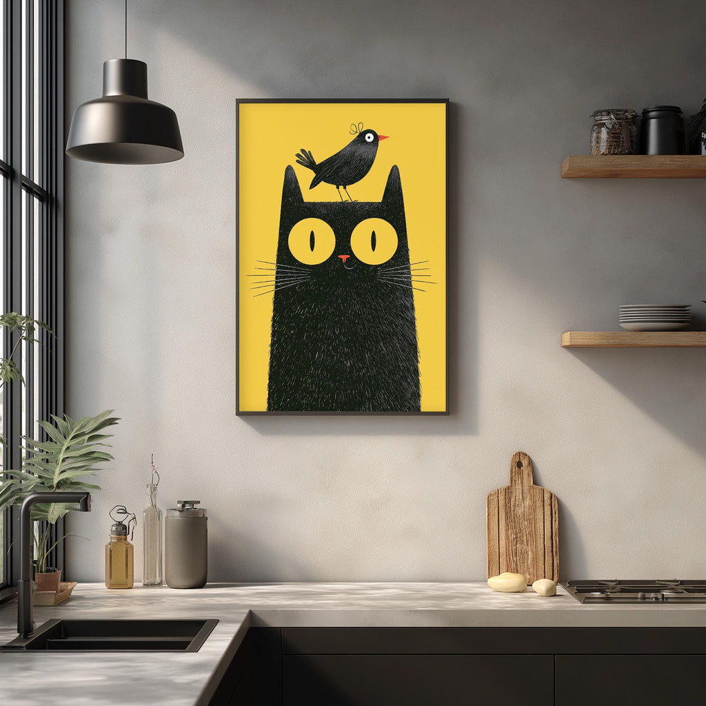a kitchen counter with various kitchen items, including a cutting board, a bottle, and a jar. Above the counter, there is a framed illustration of a black cat with a bird perched on its head.