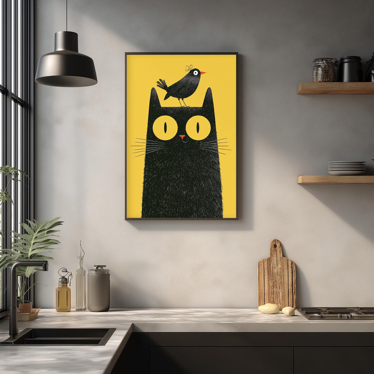 a kitchen counter with various kitchen items, including a cutting board, a bottle, and a jar. Above the counter, there is a framed illustration of a black cat with a bird perched on its head.