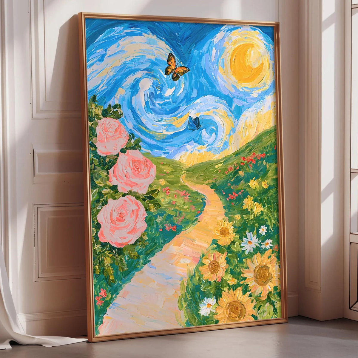 A large framed painting depicting a vibrant garden scene with a winding path, pink roses, yellow sunflowers, and a blue sky with a yellow sun.