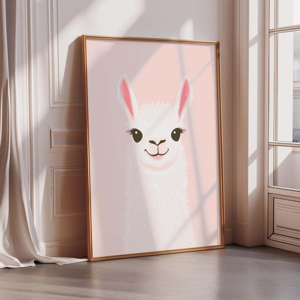 A framed illustration of a smiling llama with large eyes and pink ears is displayed on a wall in a room with a window.