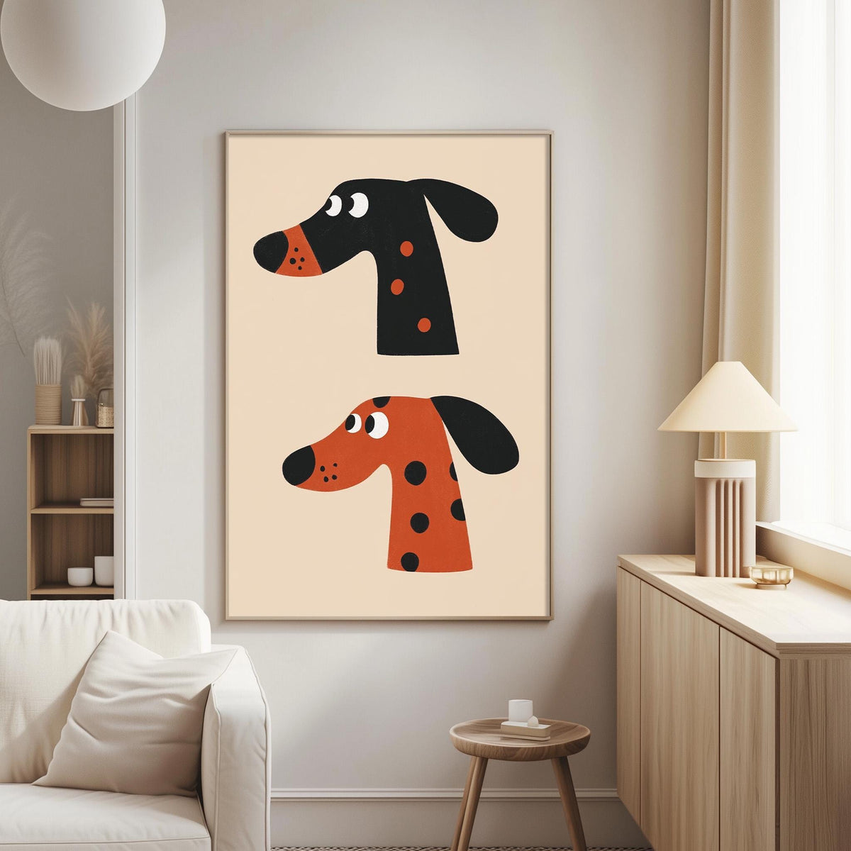 a living room with a white couch, a wooden side table, and a framed poster of two cartoon dog heads on the wall.