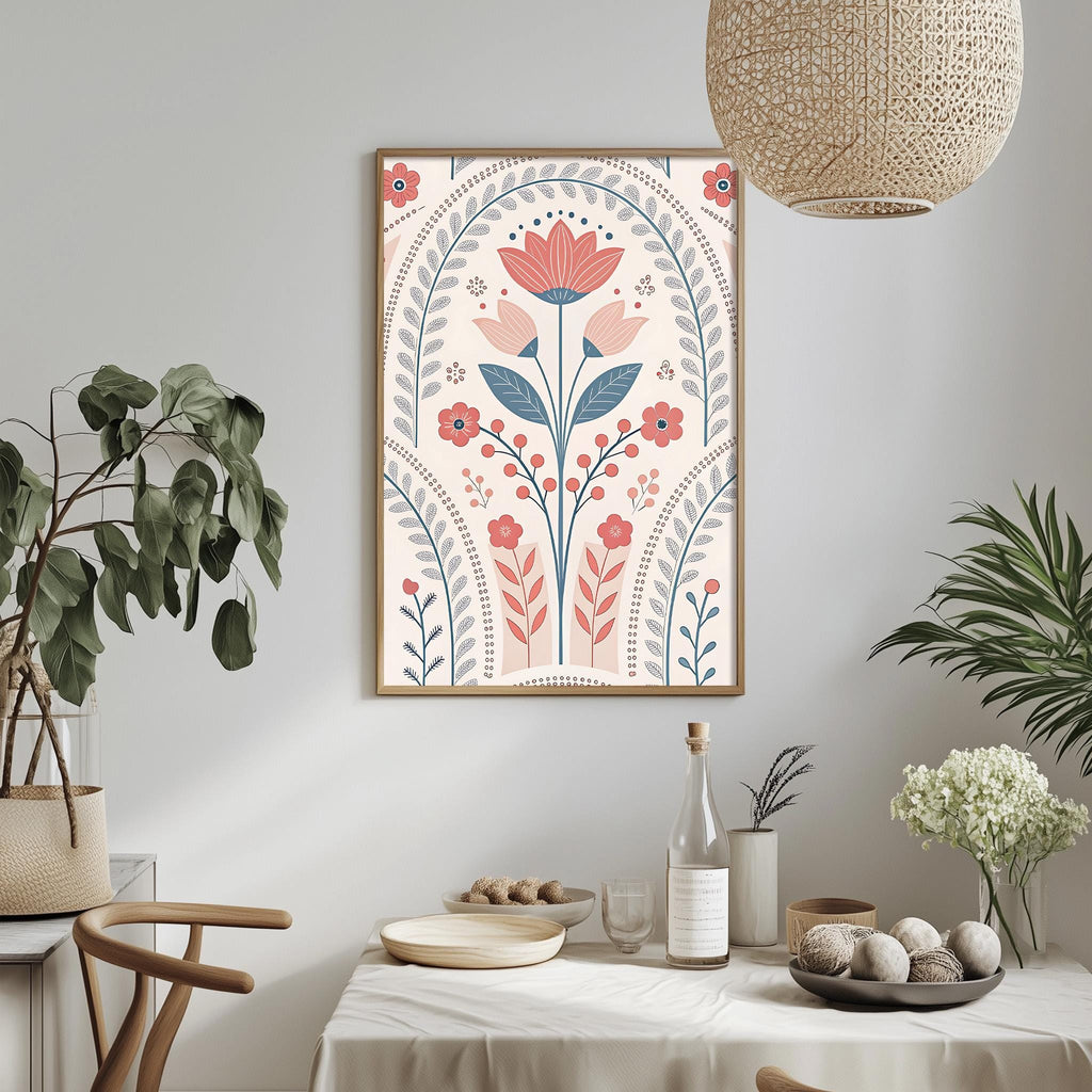 a dining table with a white tablecloth, a bowl of fruit, a bottle, and a vase with flowers. Above the table, there is a framed print of a floral design with pink and blue flowers and leaves.