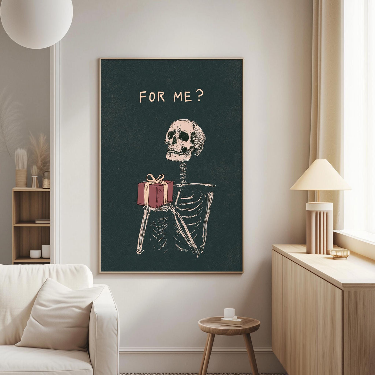 a dark green wall with a framed illustration of a skeleton holding a present, accompanied by the text "FOR ME?"
