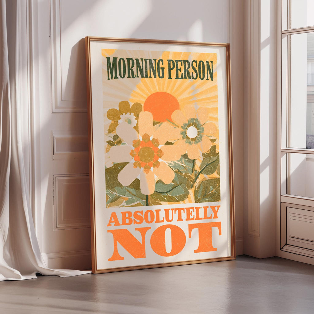 a poster with a floral design and the text "MORNING PERSON ABSOLUTELY NOT" in a bold, orange font.