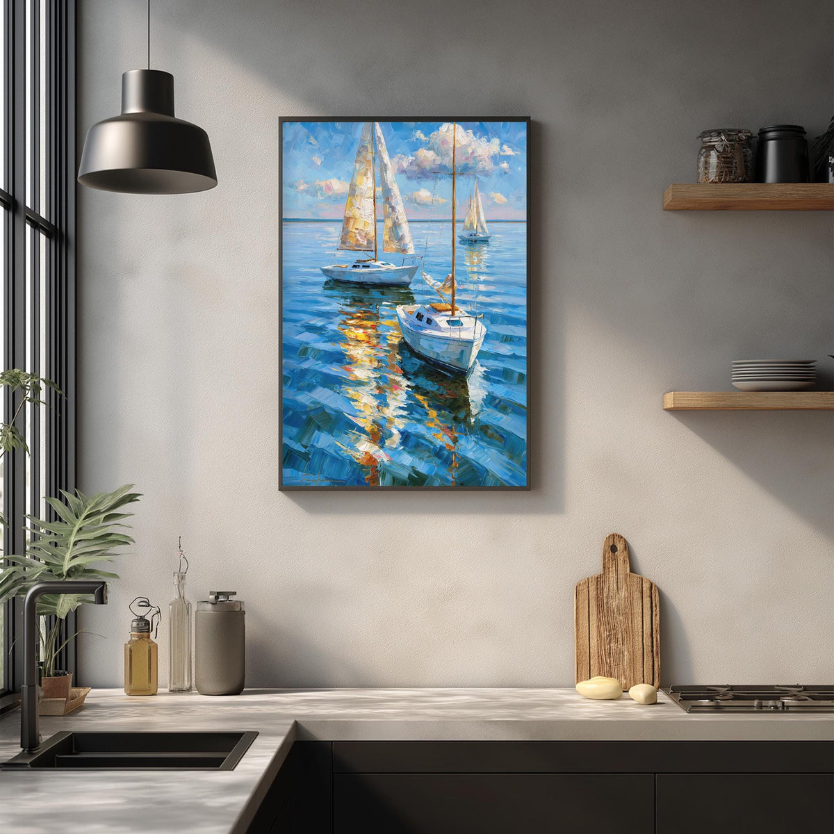a framed painting of two sailboats on the water, hanging on a wall above a kitchen counter.