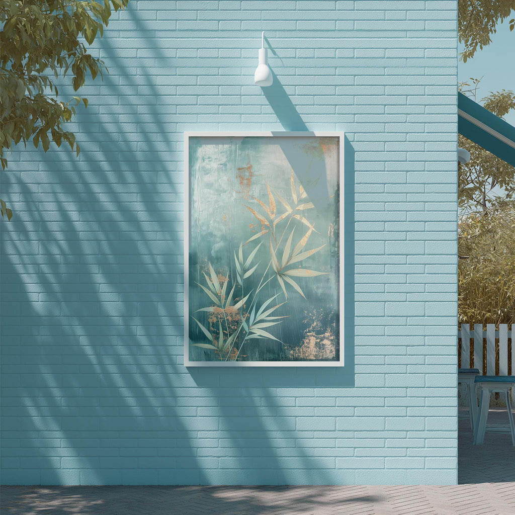 a blue brick wall with a framed painting of green leaves hanging on it. The painting is placed above a white light fixture, creating a visually appealing contrast between the colors and the lighting.