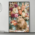 a cozy living room with a gray sofa, a coffee table, and a large framed painting of a capybara surrounded by a vibrant floral arrangement.