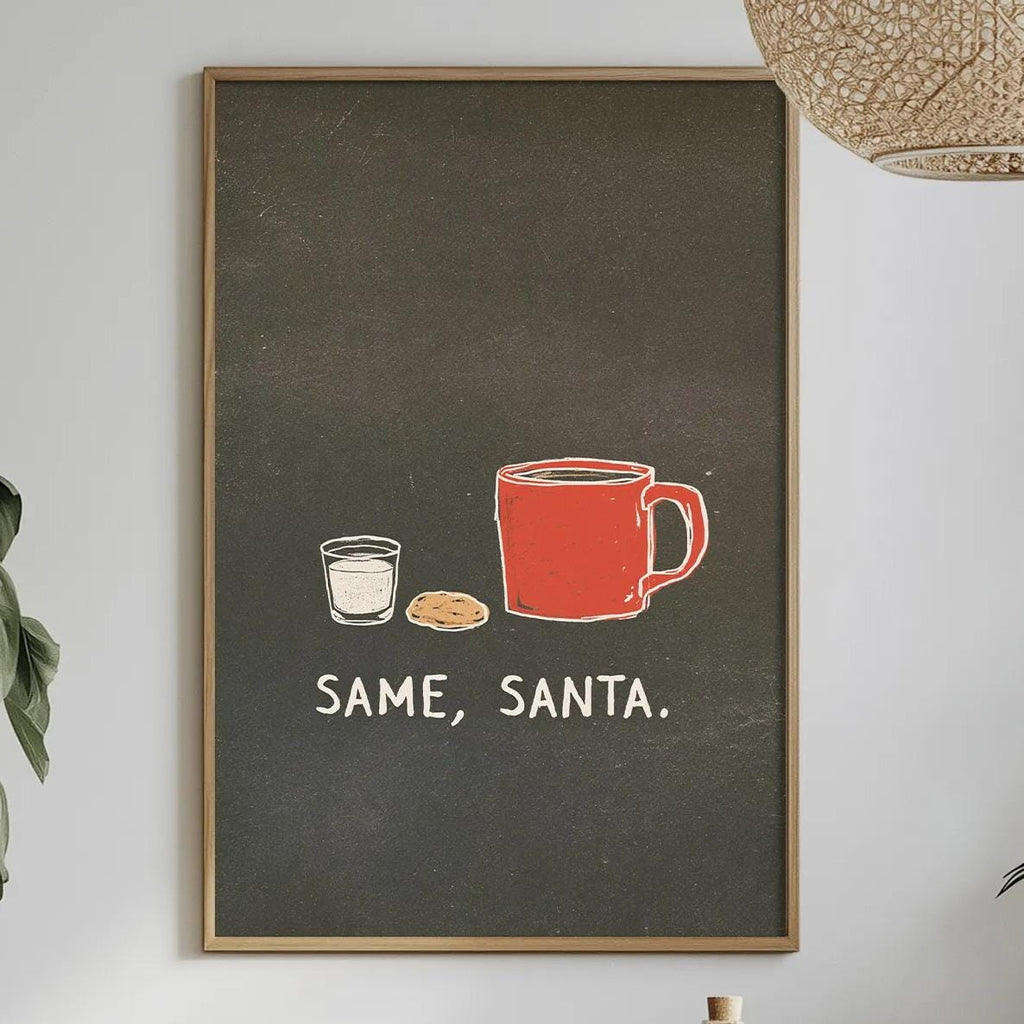 a dining table with a white tablecloth, a bowl of fruit, a bottle, and a plant. Above the table, there is a framed poster with the text "SAME, SANTA" and illustrations of a red mug and a cup.