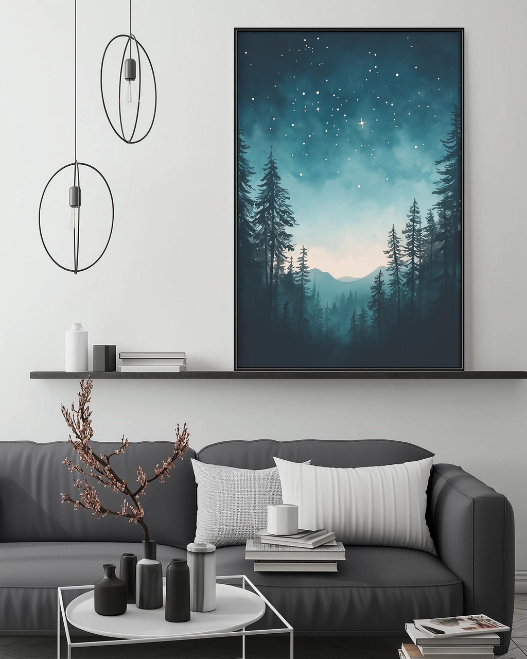 a living room with a gray sofa, a coffee table, and a large framed picture of a forest scene hanging on the wall above the sofa.