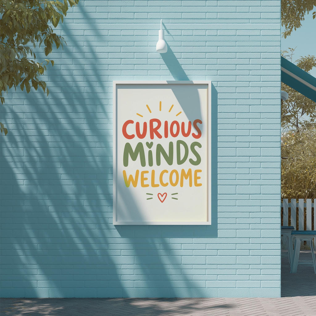 a blue brick wall with a framed sign that reads "CURIOUS MINDS WELCOME" in a vibrant, colorful font.