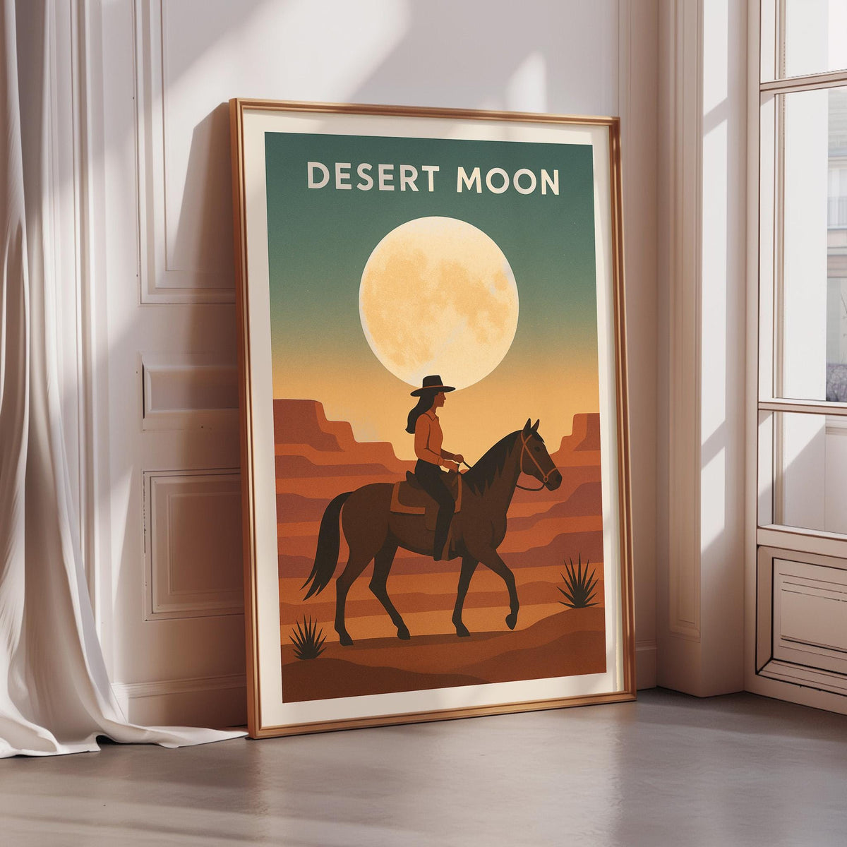 a framed poster depicting a cowboy riding a horse in a desert landscape with a large moon in the background.