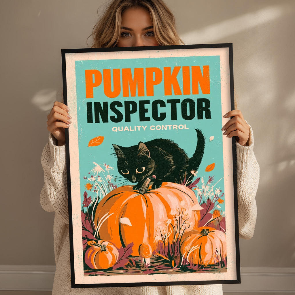 A woman is holding a framed poster with a black cat and pumpkins, with the text "Pumpkin Inspector Quality Control" on it.