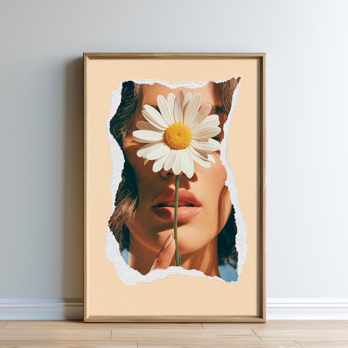 A framed image of a woman's face partially obscured by a large white daisy flower.